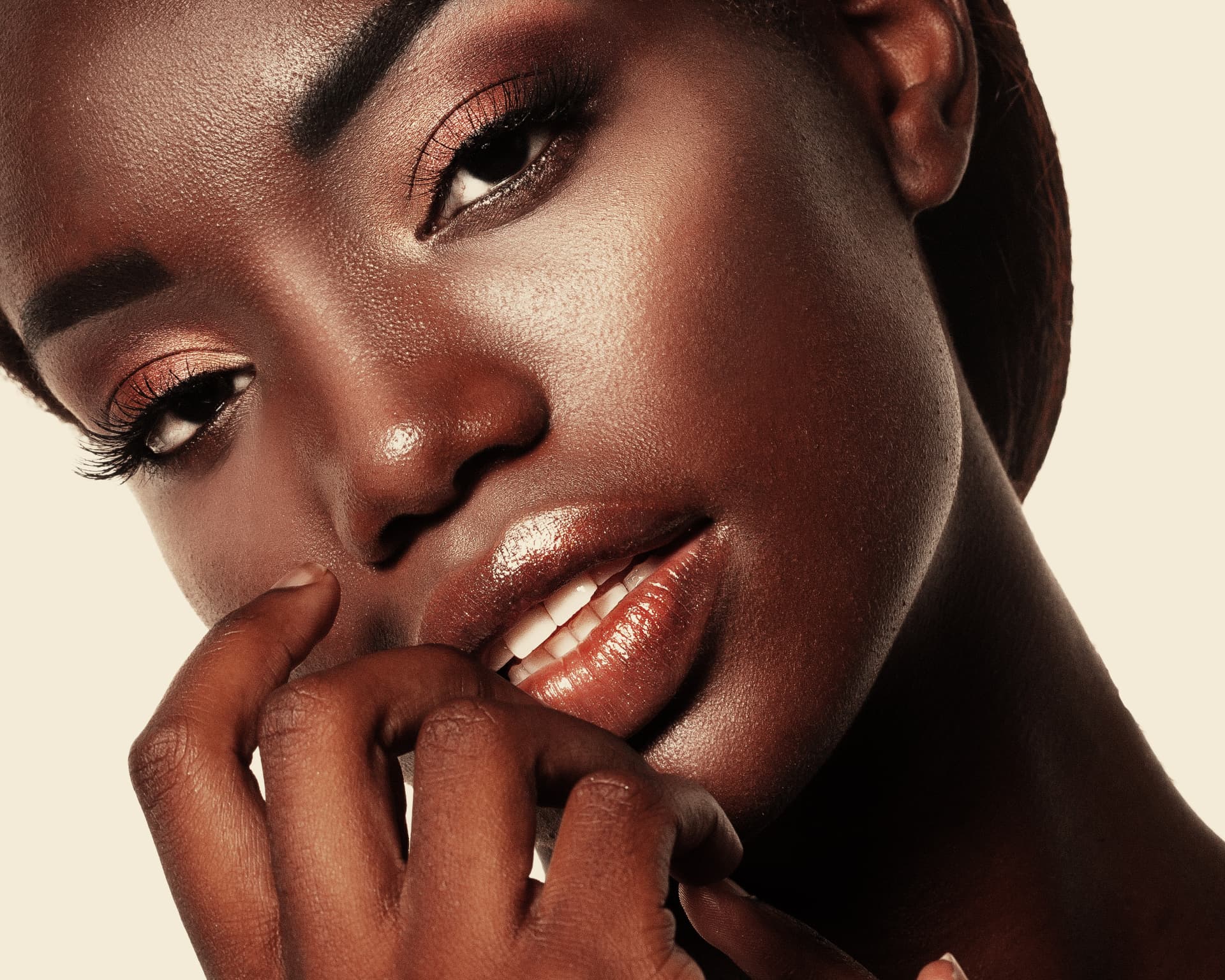 Close-up beauty portrait with glowing skin and soft glam makeup